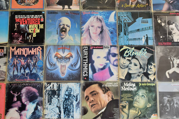 Athens, Greece - April 1, 2018: Vintage pop rock music vinyl album covers on record store wall.