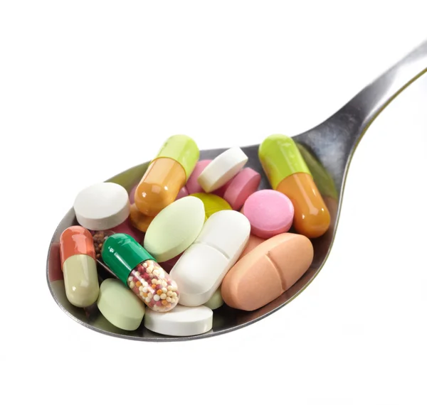 Spoon of pills — Stock Photo, Image