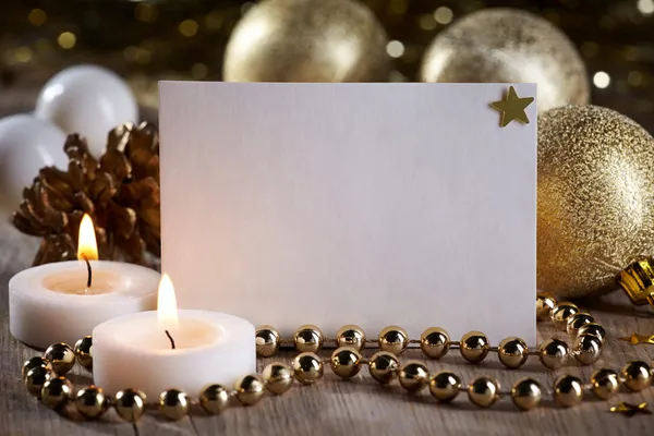 Christmas decorations and white blank card for text — Stock Photo, Image