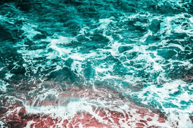 Abstract sea water texture background from above. Dramatic ocean waves landscape aerial drone view. Summer travel holiday. Vintage seascape wallpaper fine art.