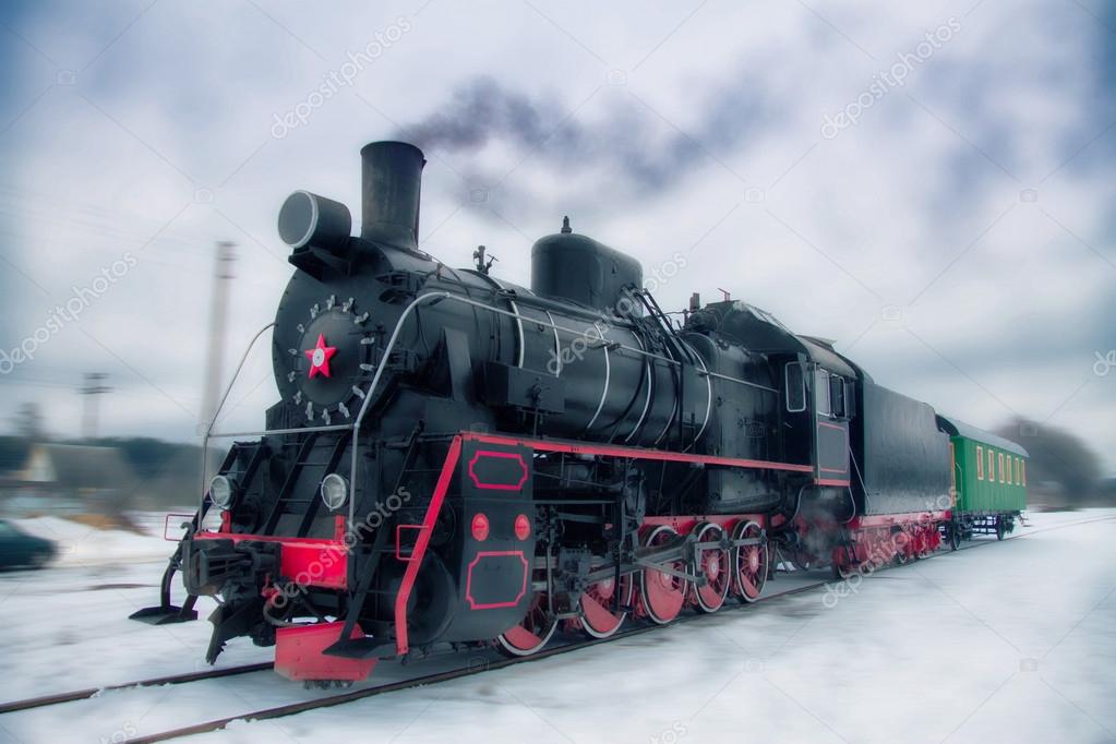 Vintage train rides on the road in the dark like a ghost from the past