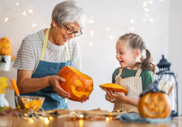 Happy Family Preparing Halloween Grandmother Granddaughter Carving Pumpkins Home — Stock Photo, Image