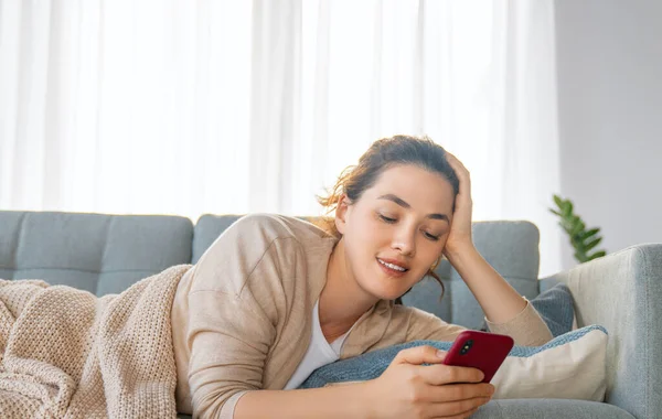 Happy Casual Beautiful Woman Using Phone Sitting Sofa Home — Stock Photo, Image