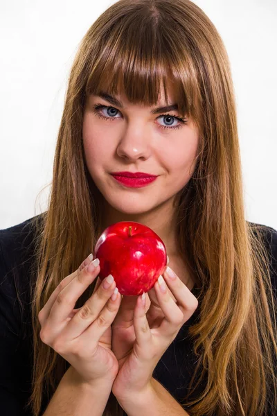 The pretty, young Girl and red apple. Isolated on white. — Stock Photo, Image