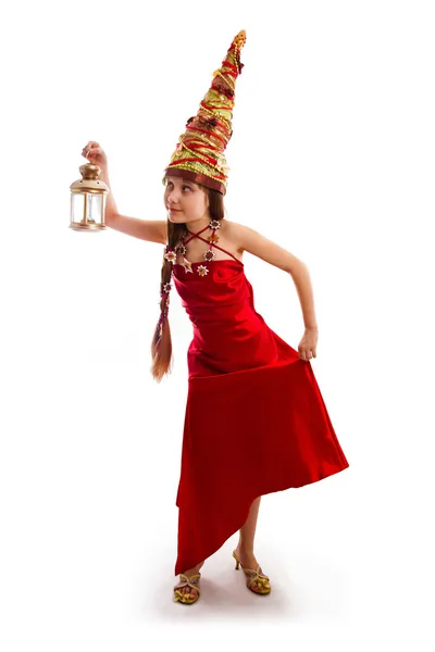Χριστούγεννα κορίτσι σε ένα καρναβάλι κόκκινο φόρεμα — Φωτογραφία Αρχείου