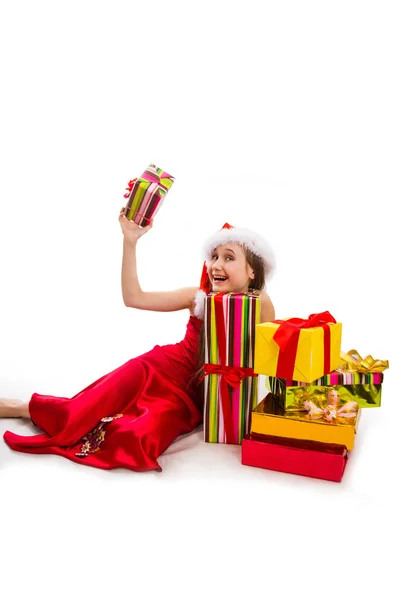 Presentes de Natal e pequena menina Santa — Fotografia de Stock