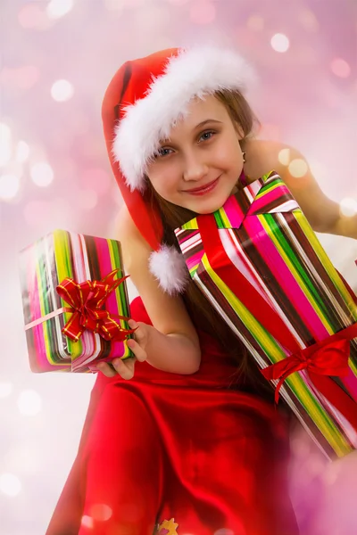 Regalos de Navidad y niña Santa — Foto de Stock