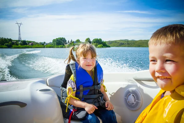 Travel of children on water in the boat — Stock Photo, Image