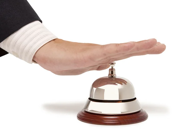 Strony biznesmena za pomocą hotel dzwon na białym tle — Zdjęcie stockowe