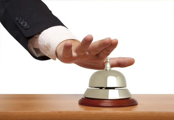 Egy üzletember, használja a hotel bell elszigetelt keze — Stock Fotó