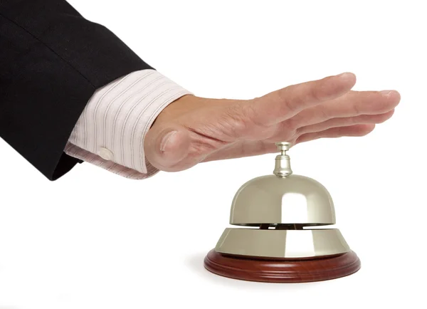 Hand of a businessman using a hotel bell isolated — Stock Photo, Image