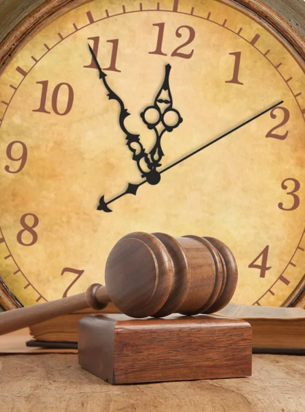 Wooden gavel and clock