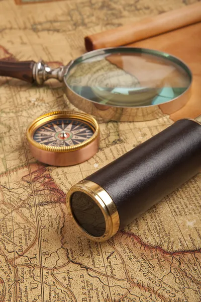 Brass telescope on map — Stock Photo, Image