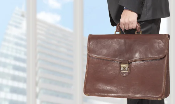 Businessman holding a briefcase — Stock Photo, Image