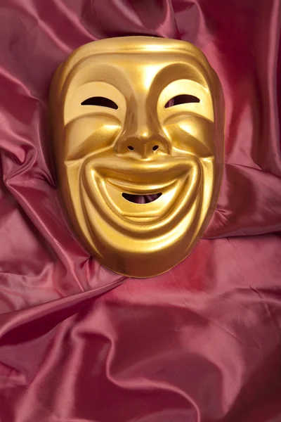 Golden comedy theatrical mask — Stock Photo, Image