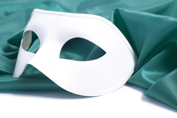 White theatrical mask and silk fabric — Stock Photo, Image