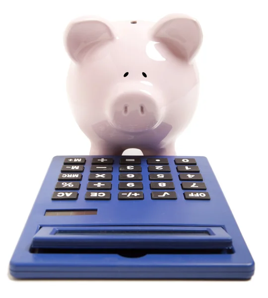 Pink piggy bank and calculator — Stock Photo, Image