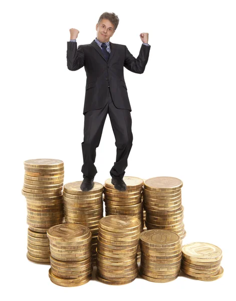 Businessman standing on money — Stock Photo, Image