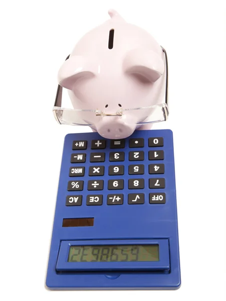 Pink piggy bank and calculator — Stock Photo, Image