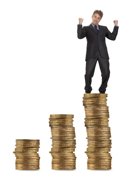 Businessman standing on money — Stock Photo, Image