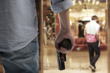 Man Holding Gun clipart