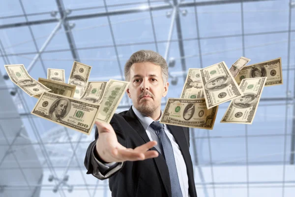 Businessman throwing dollar — Stock Photo, Image