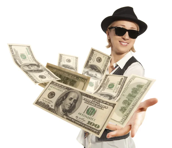 Woman in cap throwing dollar — Stock Photo, Image