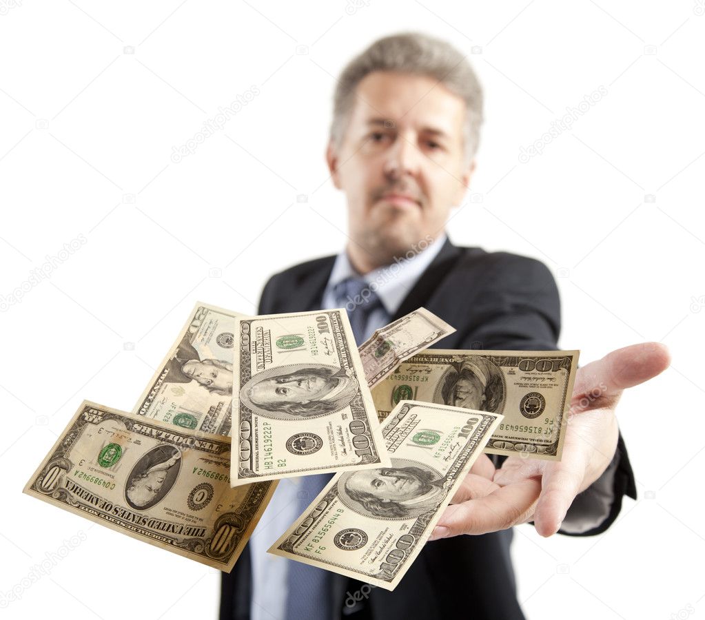 Businessman throwing dollar