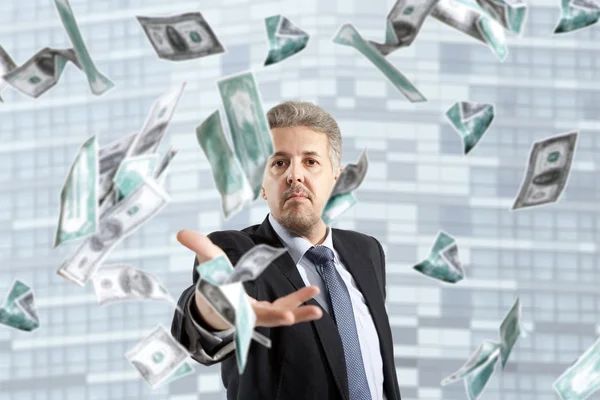 Businessman throwing dollar — Stock Photo, Image