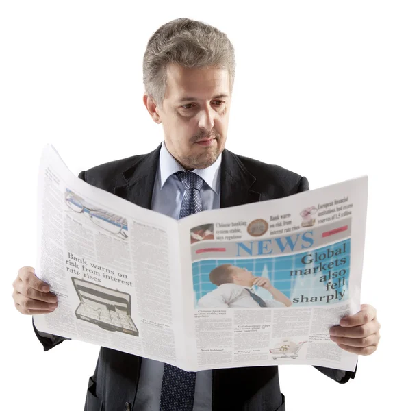 Businessman reading a newspaper — Stock Photo, Image