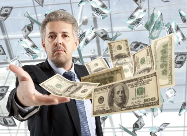 Businessman throwing dollar — Stock Photo, Image