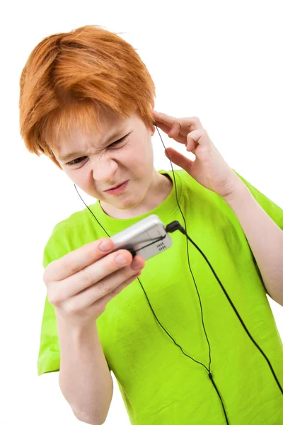 Red teen listens to music — Stock Photo, Image