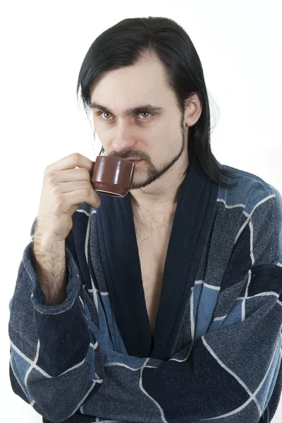 Sleepy man in housecoat with little cup of coffee — Stock Photo, Image