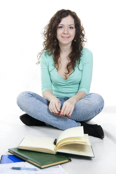 Dziewczyna jednego z okulary i książek na białym tle — Zdjęcie stockowe