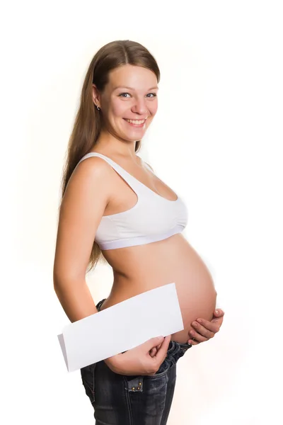 Έγκυος γυναίκα με μια κενή φόρμα Royalty Free Φωτογραφίες Αρχείου