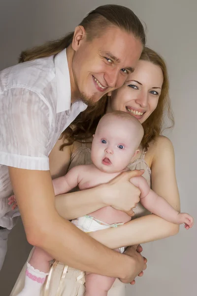 Naked mother and the father hold the kid on hands — Stock Photo, Image