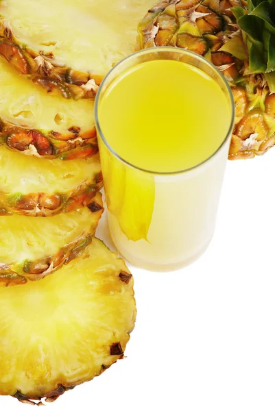 Glass of juice and pineapple slices — Stock Photo, Image