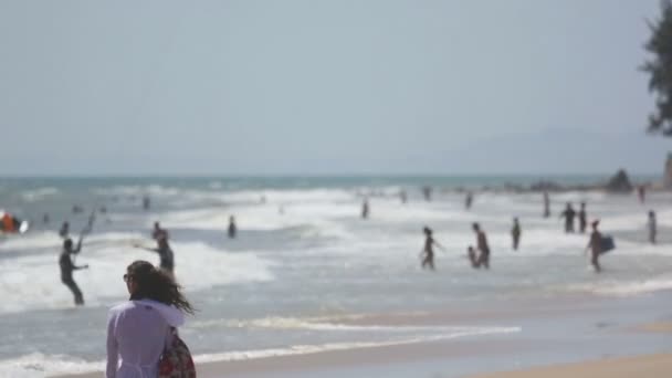 Holidaymakers on the beach Video Clip