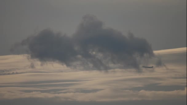Airplane flies through the cloud — Video