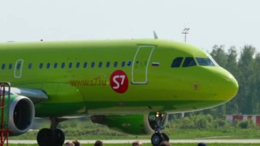 Medium shot, S7 airlines plane