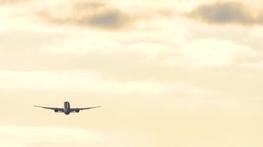 Airplane silhouette sunset sky