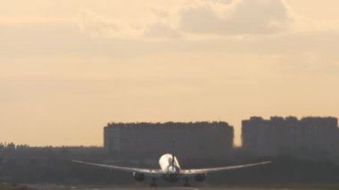 Airplane takeoff at dawn
