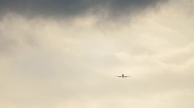 Airplane landing at cloudy