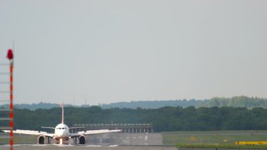 View through haze, plane landing