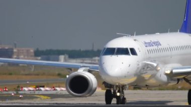 FRANKFURT AM MAIN, GERMANY - JULY 18, 2017: Footage of Embraer Lufthansa taxiing to the terminal after landing at Frankfurt International Airport, Germany. Tourism and travel concept