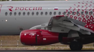 MOSCOW, RUSSIAN FEDERATION - JULY 29, 2021: Side view of Sukhoi Superjet Rossiya taxiing along the runway to the terminal after landing at Sheremetyevo Airport, Moscow SVO. Narrow-body airliner