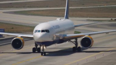 FRANKFURT AM MAIN, GERMANY - JULY 19, 2017: Passenger Boeing 767 of Icelandair rides on the taxiway to the airport terminal Frankfurt, Germany. Icelandair Icelandic airline. Tourism and travel concept