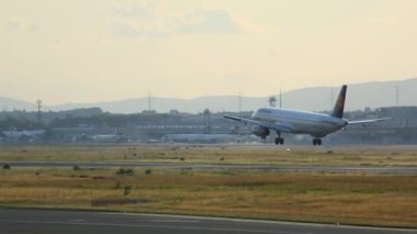 FRANKFURT AM MAIN, GERMANY - JULY 20, 2017: Lufthansa Airbus A321 approaching and landing at 25L. Fraport, Frankfurt, Germany