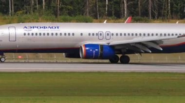 MOSCOW, RUSSIAN FEDERATION - JULY 29, 2021: Commercial plane Boeing 737 of Aeroflot braking after landing at Sheremetyevo airport, side view. Tourism and travel concept, air flight