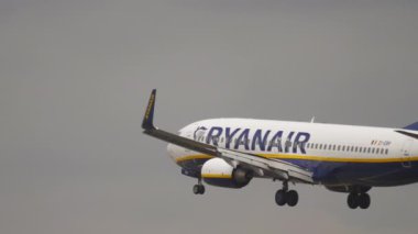 FRANKFURT AM MAIN, GERMANY - JULY 20, 2017: Airplane Boeing 737 Ryanair descending for landing at runway at 25L Fraport, Frankfurt, Germany. Aviation, tourism and travel concept
